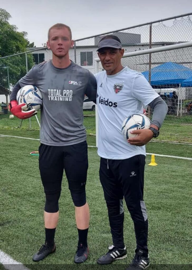 Goalkeeper Coach Martin Viveros with the young goalkeeper Elijah Miller
