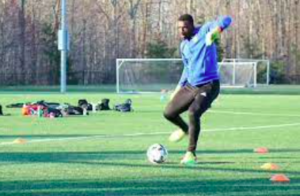 Chrisitan Caulker Goalkeeper Training and kicking a soccer ball just like beginning goalekeepers should do