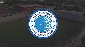 American Soccer players can play a gap year at the International Development Academy Logo with background